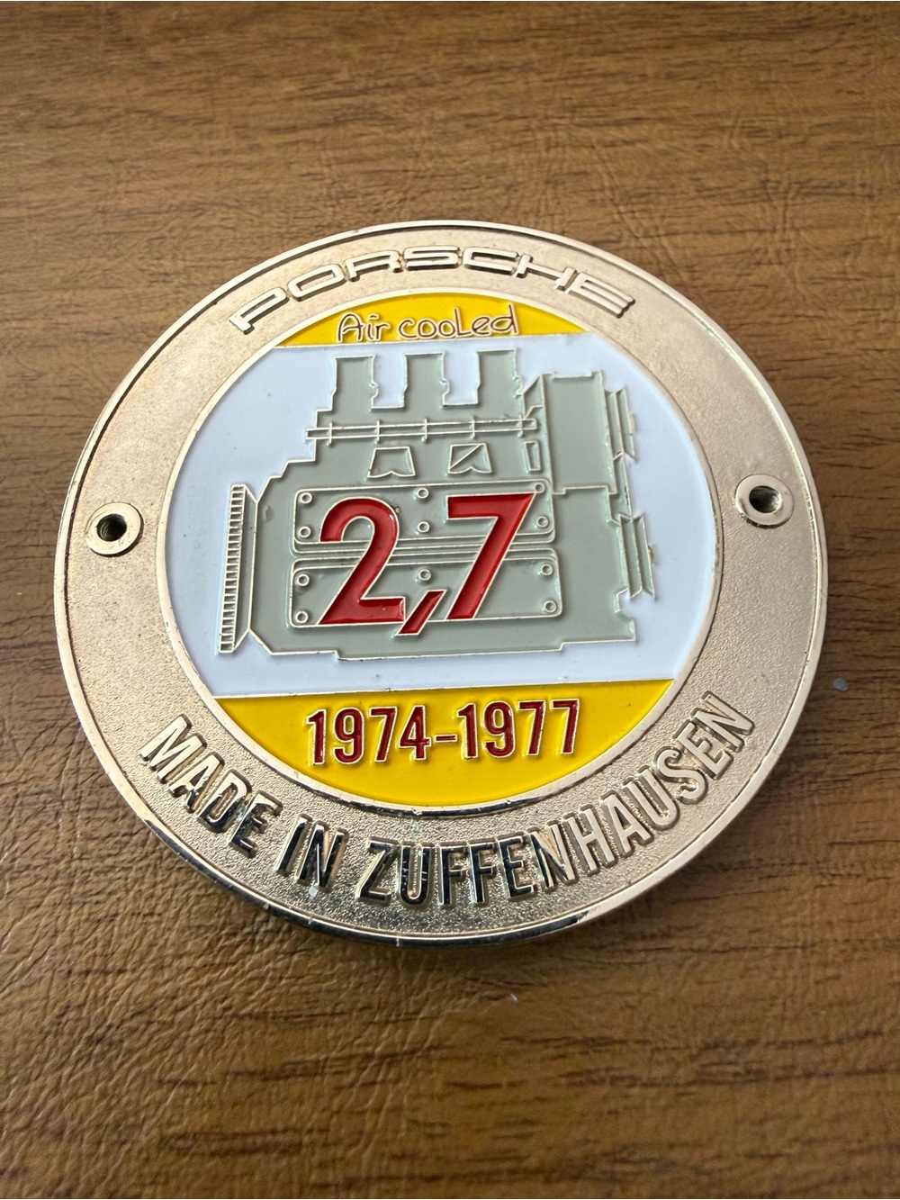 vintage-style Porsche 2.7L air-cooled engine grille badge 1974-1977 production.
